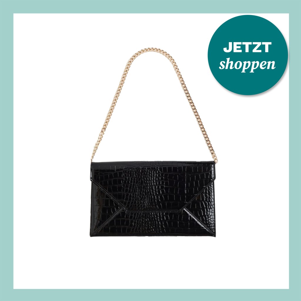 Elegante schwarze Tasche, die sich zu Weihnachten schick stylen lässt.